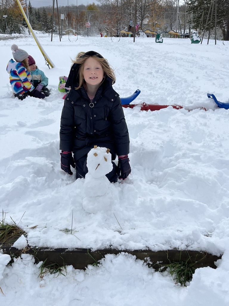 girl building snowman