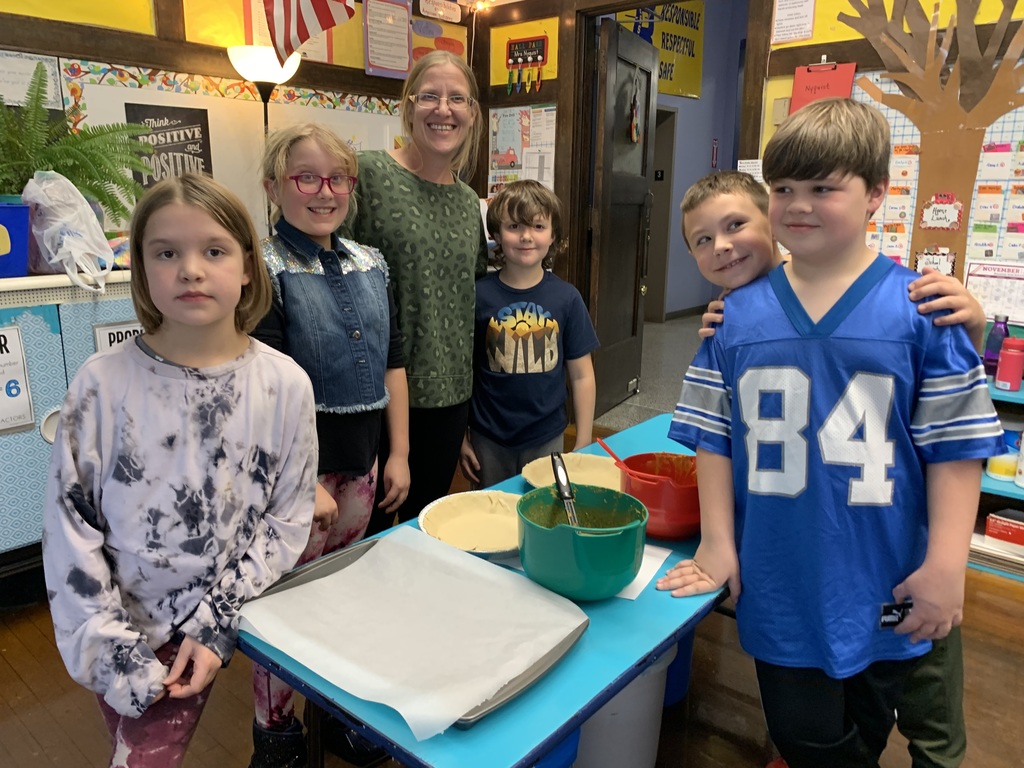 Students and parent with pumpkin pie ingredients