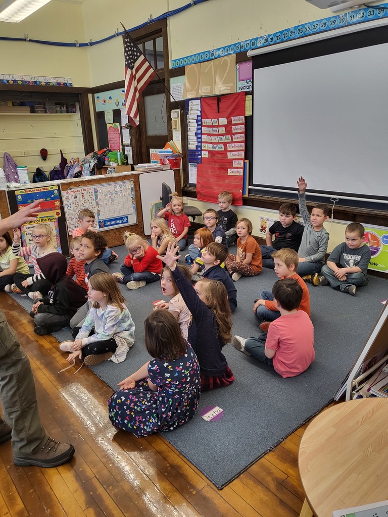 kindergarten students listening to presentation