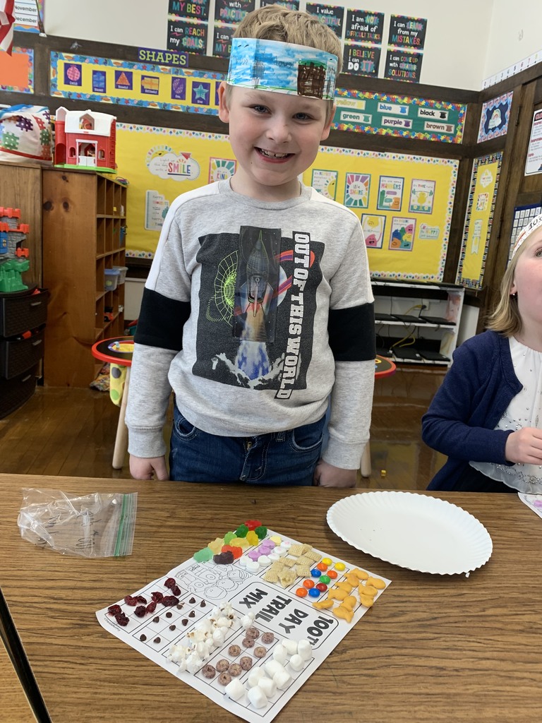 Boy with craft for 100th day of school