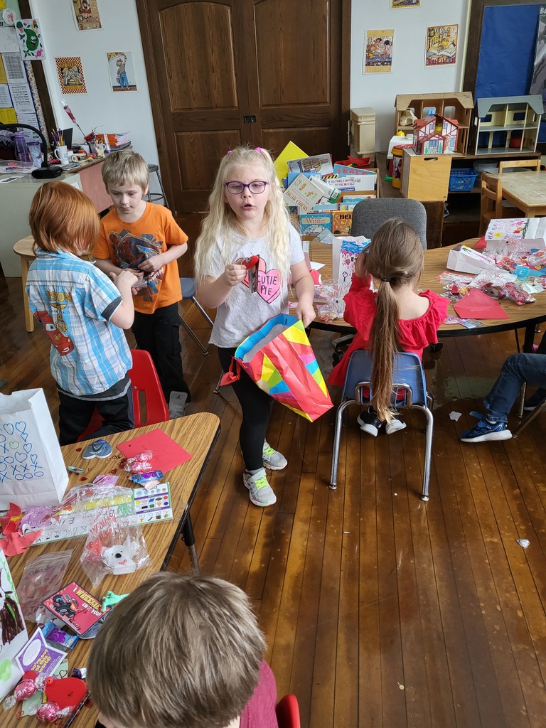 Kindergarten students passing out Valentines