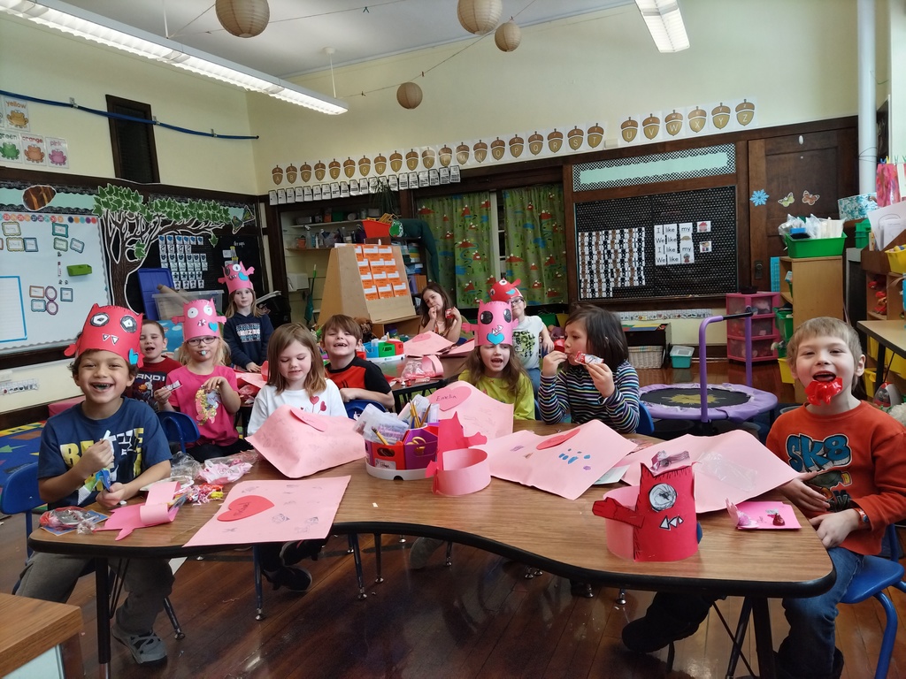Kindergarten students making monster valentine craft