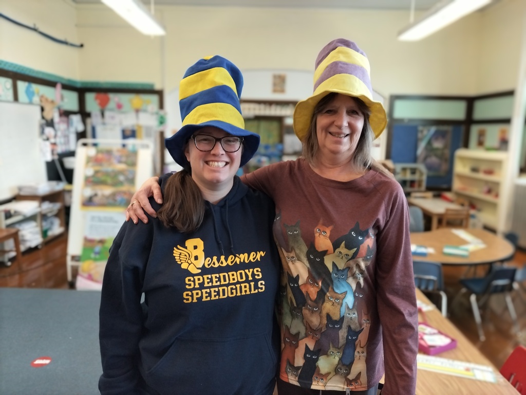 two women wearing Dr. Seuss hats
