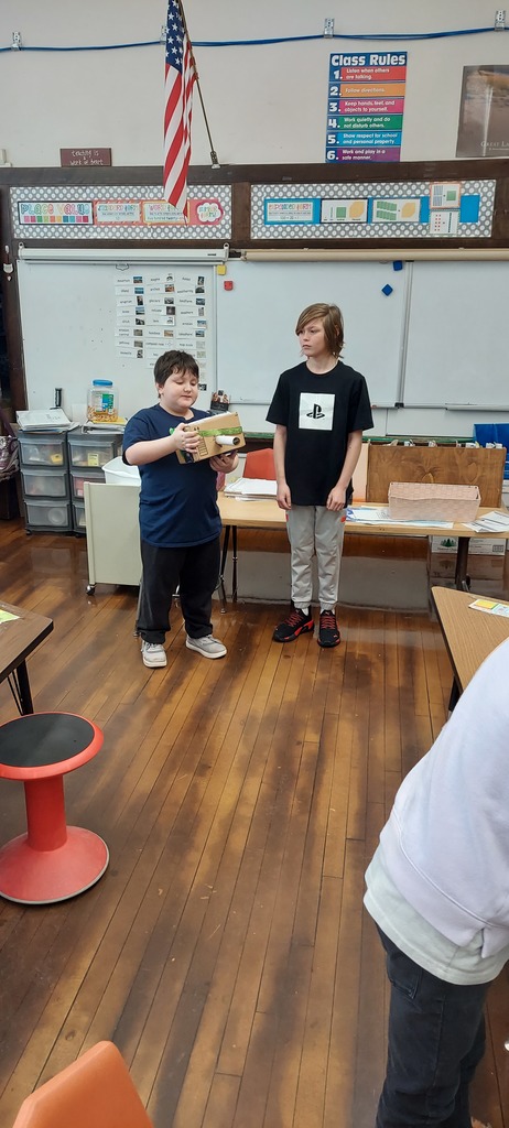 2 boys presenting project