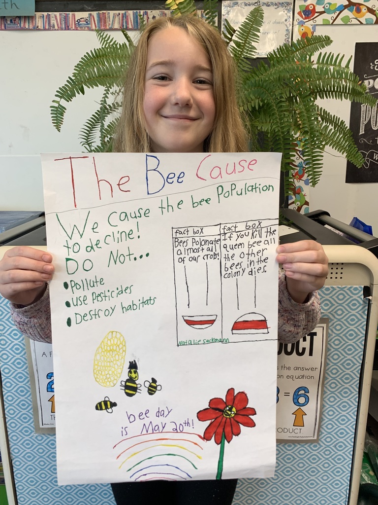  Student holding Save the Bees poster