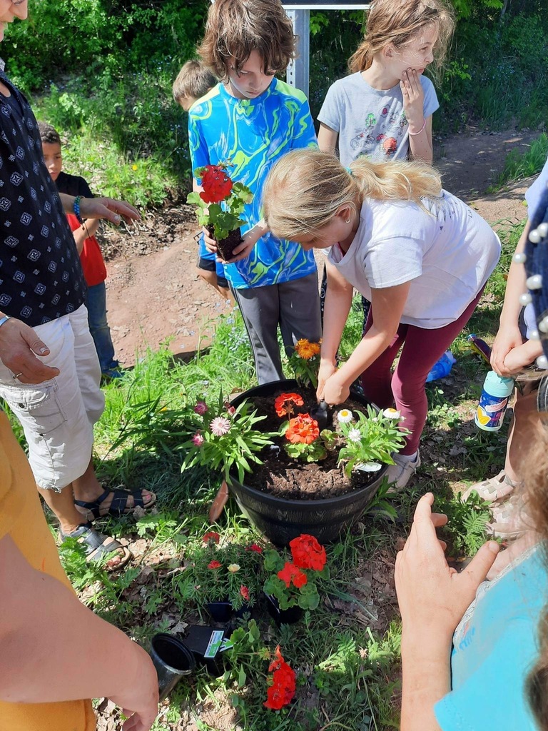students planting flowers