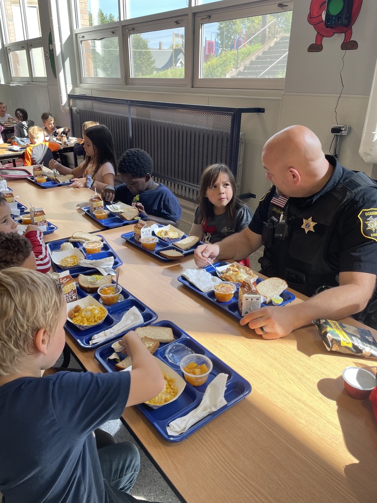 officer eating lunch with student